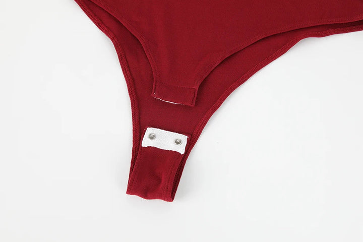 Sleeveless bodysuit with high neck